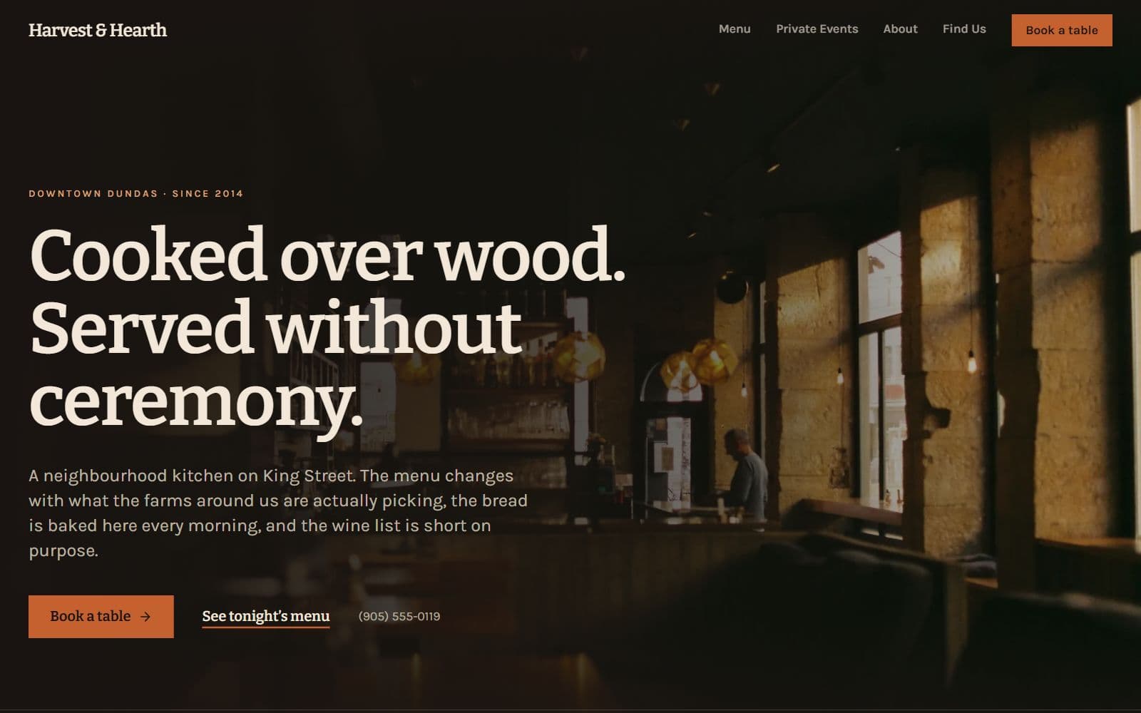 Harvest & Hearth homepage: a dim dining room behind the headline “Cooked over wood. Served without ceremony.”